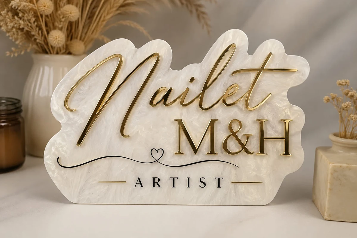 Original Nailet M&H Artist logo in gold tones